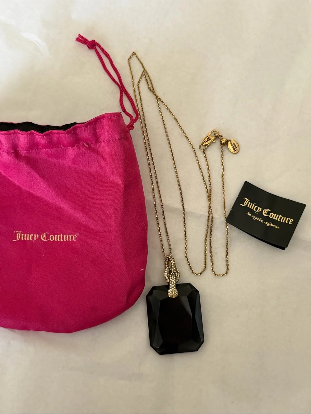 Juicy Couture gold tone